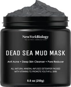 Black jar of Dead Sea mud mask with text and product details