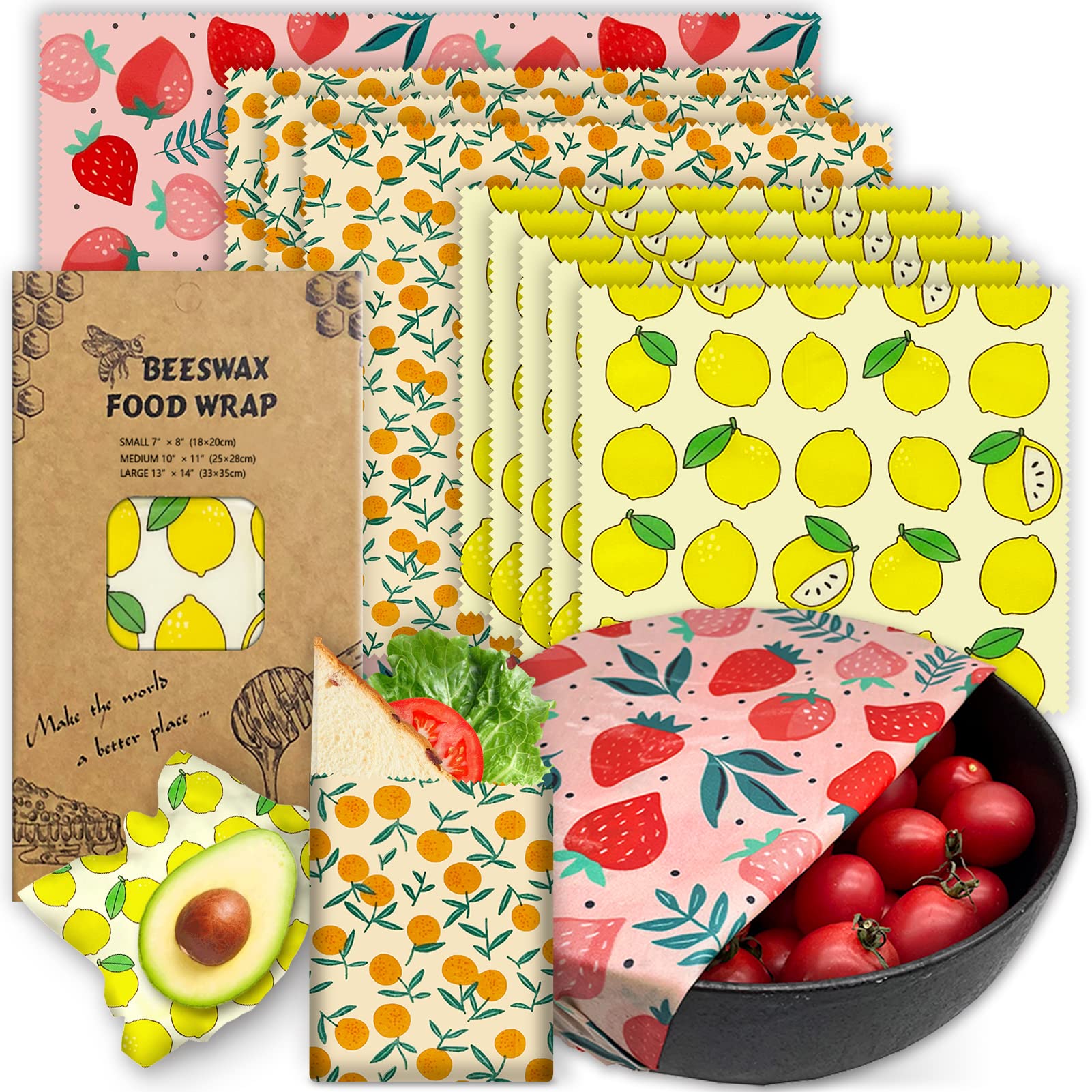 Beeswax food wraps with fruit patterns, wrapped food, and a bowl of tomatoes