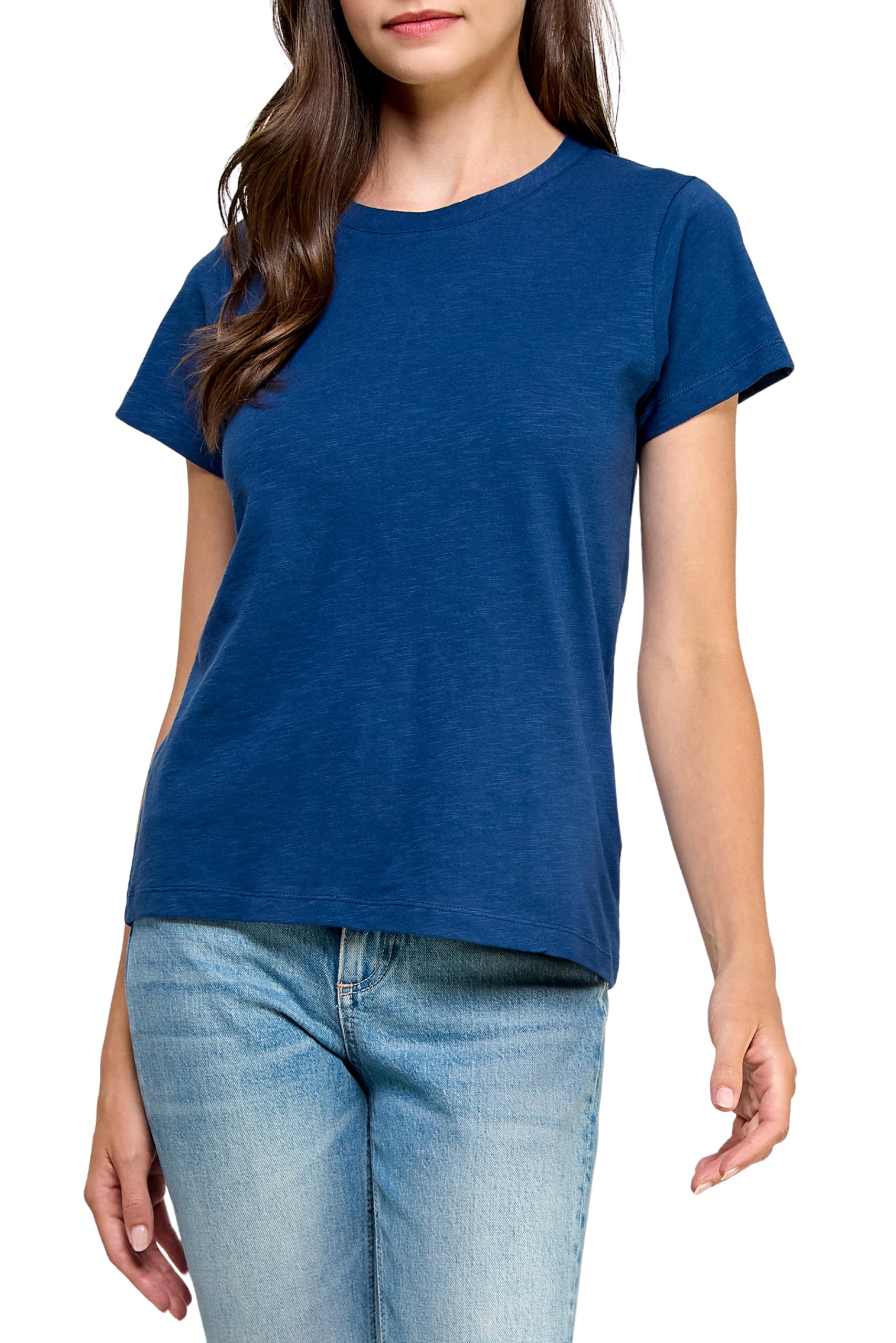 Woman wearing a blue t-shirt and jeans, walking towards the viewer